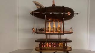 Steam punk zeppelin made out of wood. Steam engines power the prop. Interior is detailed and lighted.